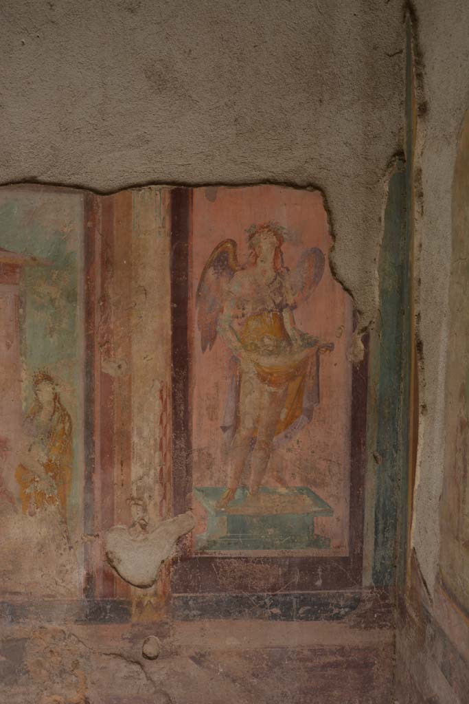 V.1.18 Pompeii. October 2019. 
Exedra “y”, west wall at north end. Wall painting of a winged figure possibly a muse.
Foto Annette Haug, ERC Grant 681269 DÉCOR.
