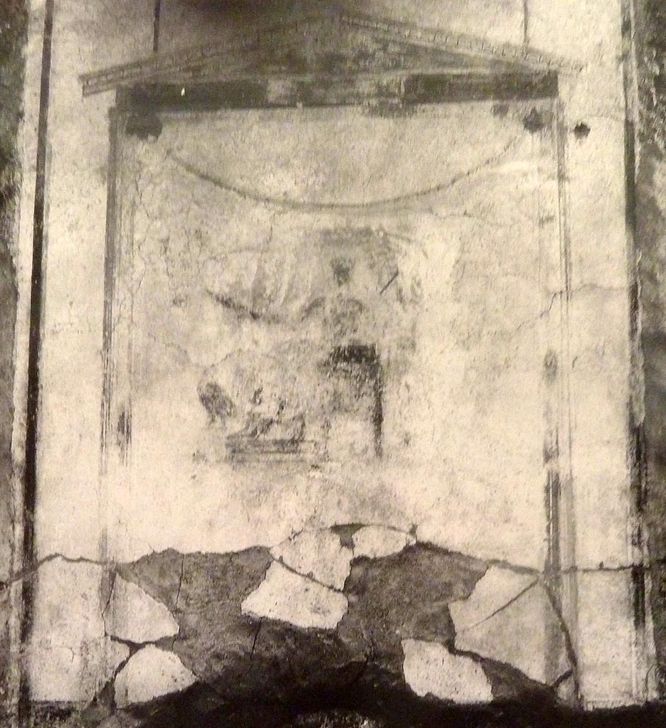 V.2 Pompeii. Casa di Orione. Old undated photograph. 
North wall of peristyle garden 11c. Remains of central painting in lararium.
Giove (Jupiter) sits on a throne, his lower body covered with a green robe. 
The sceptre is in the left hand, leaning on the arm of the throne. 
The lightning bolt is in his outstretched right hand and the eagle at his feet. 
See Notizie degli Scavi di Antichità, 1894, p. 439.


