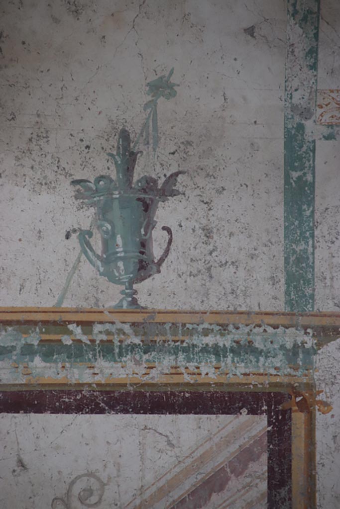 V.7.6 Pompeii. October 2023. Detail from south side of central panel. Photo courtesy of Klaus Heese. 