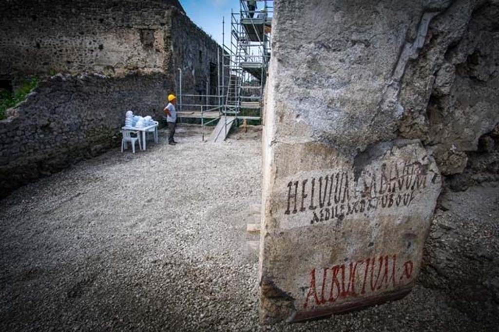 V.7.8 Pompeii. June 2018. Electoral inscriptions on outside east wall around the corner in Vicolo c.d. dei Balconi.
Looking west along new excavated part of Vicolo delle Nozze dArgento towards V.2.i, from electoral inscriptions.  
Photograph  Parco Archeologico di Pompei.