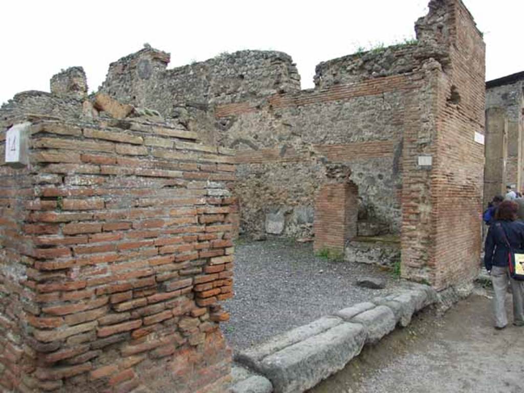 VI.10.15 Pompeii. May 2010. Looking east to shop. According to Pagano and Prisciandaro, found in April 1824 on the pilaster on the left of the entrance, was 
Priscum    [CIL IV 263]
Found in September 1829, on the pilaster on the south-east corner of the insula (on the right of the photo above) was 
C(aium) Calventium Sit[3]
IIvir(um) i(ure) d(icundo)    [CIL IV 276]
See Pagano, M. and Prisciandaro, R., 2006. Studio sulle provenienze degli oggetti rinvenuti negli scavi borbonici del regno di Napoli.  Naples : Nicola Longobardi. (p.142)  PAH II, 224; III (dated 17th March 1831), 115.

