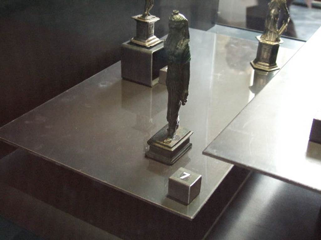 VI.14.27 Pompeii. Found in room b. Bronze statuette of Isis found in house.  
Now in Naples Archaeological Museum.
