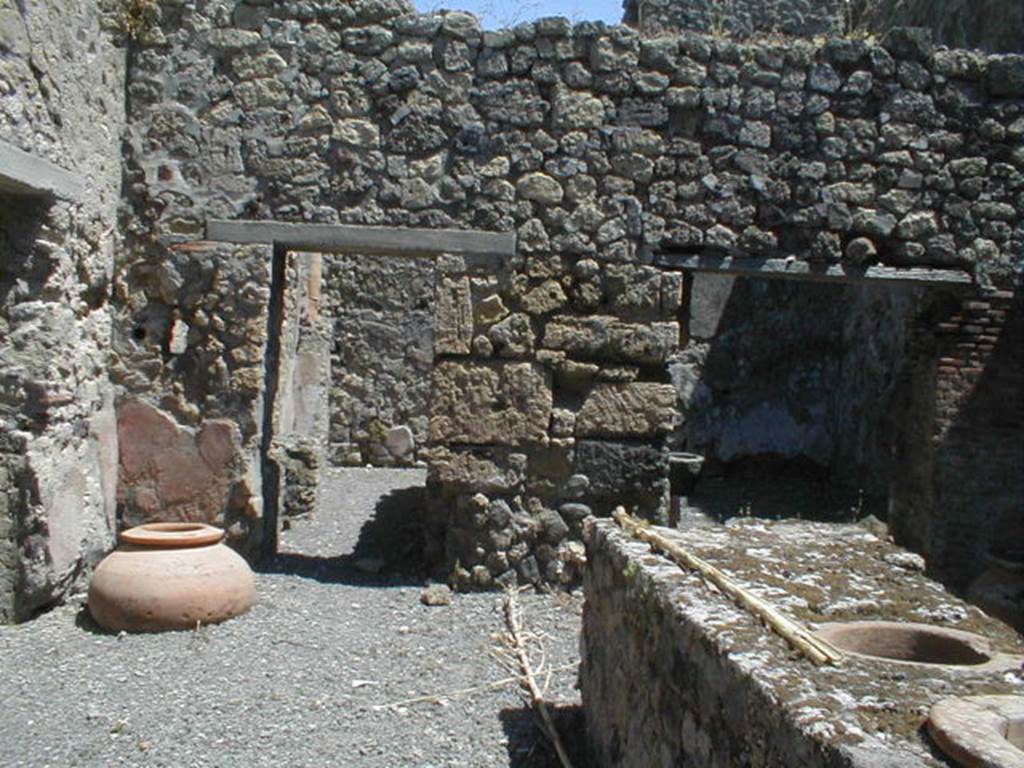 VI.14.36 Pompeii. May 2005. Looking east across bar-room to rear rooms.