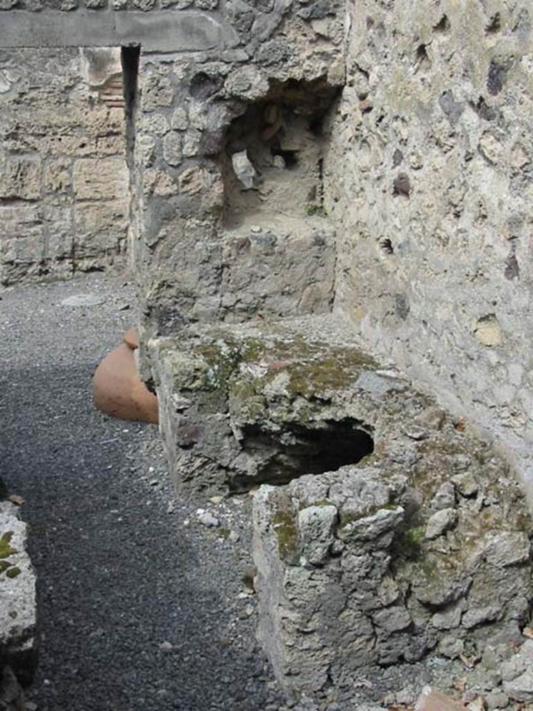 VI.14.36 Pompeii. May 2013. Hearth in north-west corner of kitchen. Photo courtesy of Nicolas Monteix.
