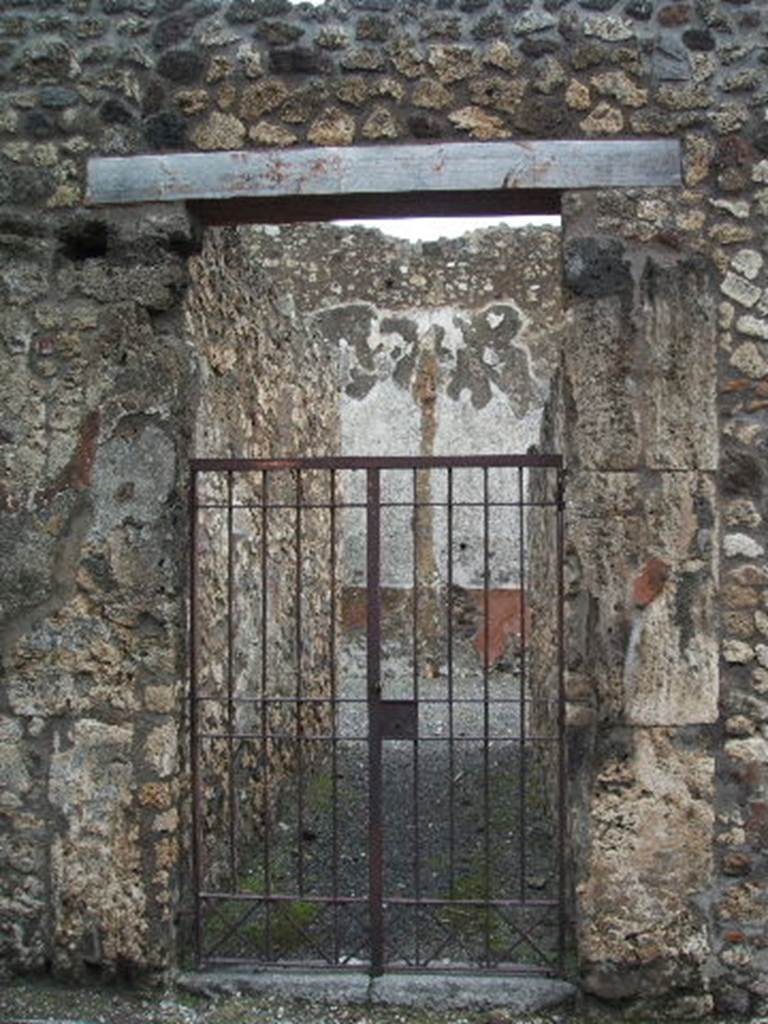 VI.14.37 Pompeii. December 2005. Entrance doorway. According to Della Corte, this was a modest house furnished with an upper floor, from which space for the Bar of Salvius had been taken originally. Probably the upper floor was used for living in, and the lower floor was occupied by the workshop. The paintings that adorned the right pilaster of the entrance, showed the industry that was carried on here. Mercury with purse and caduceus, and a carpenter sawing a beam with the help of a lad. On a seal/signet found here was 
       Potiti 
Popp. Sabini  
       (P.P.S)               [CIL X 8058, 71]
See Della Corte, M., 1965.  Case ed Abitanti di Pompei. Napoli: Fausto Fiorentino. (p.83, S.75)
According to Epigraphik-Datenbank Clauss/Slaby (See www.manfredclauss.de), this read 
Potiti 
Popp(aei) Sabini 
P(otiti) P(oppaei) S(abini)      [CIL X 8058, 71]
