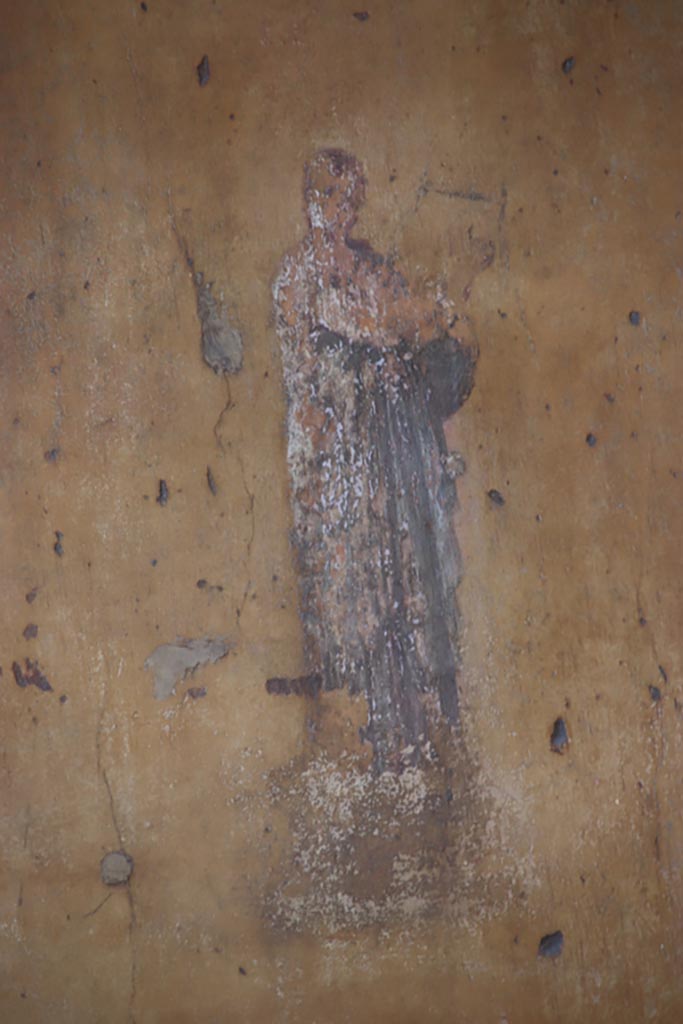 VII.1.47 Pompeii. October 2023.  
Exedra 10, detail of Erato with lyre, from middle of side panel at east end of north wall. 
Photo courtesy of Klaus Heese.
