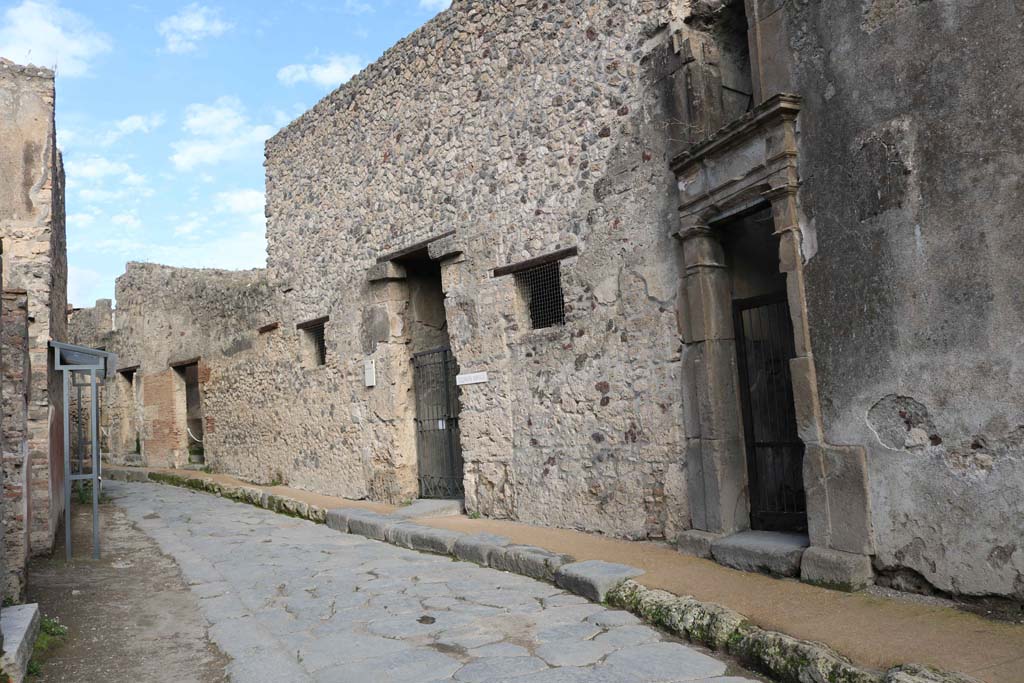 VII.1.47, Pompeii. December 2018. 
Entrance doorway, in centre, on east side of Vicolo del Lupanare, with VII.1.48, on right. Photo courtesy of Aude Durand.

