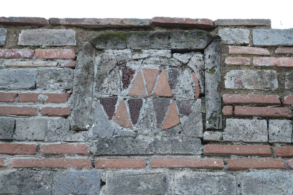 VII.2.1 Pompeii. December 2018. Looking west towards plaque on pilaster between VII.2.1 and VII.2.2. Photo courtesy of Aude Durand.

