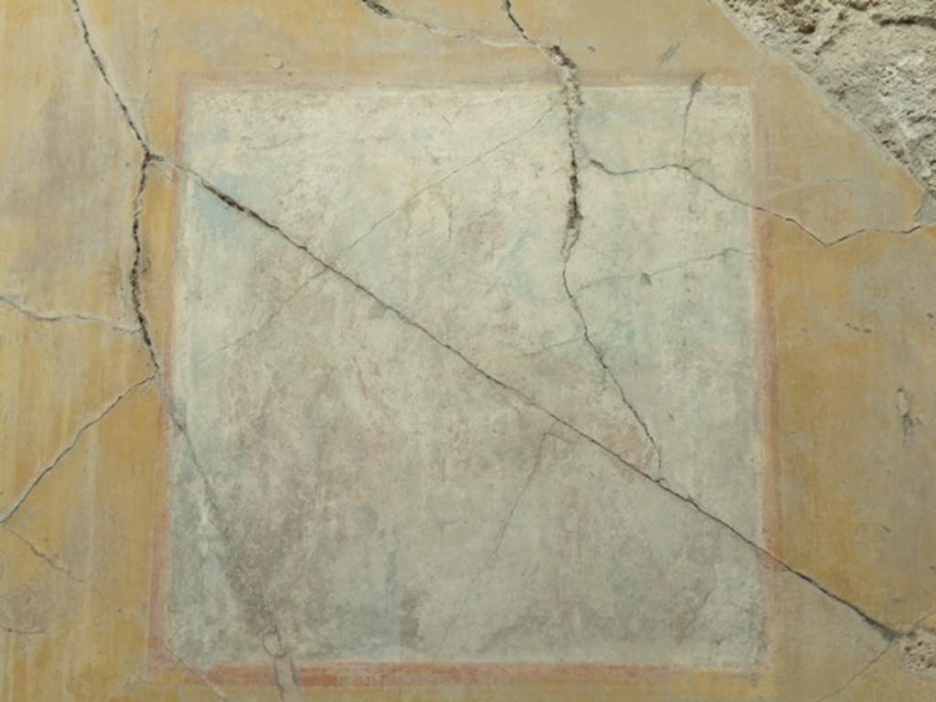 VII.4.31 Pompeii.  March 2009.  Room 12. Oecus.  Remains of very faded wall painting. A seated Ciparissus is on the right with a stag by his side, and Apollo standing on the left.