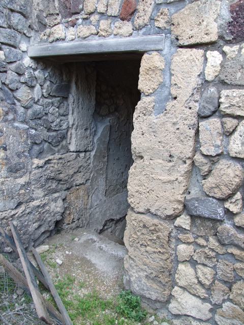 VII.4.31 Pompeii.  March 2009.  Room 25.  North wall and door to Cellar, Room 27.