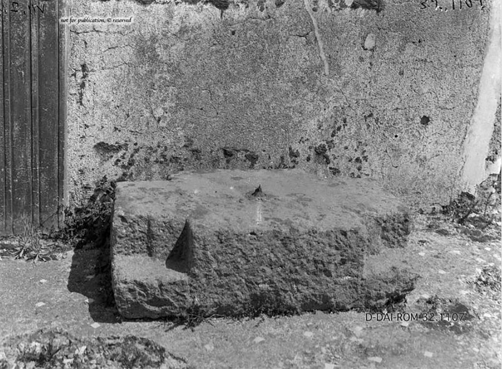 VII.7.10/13 Pompeii. 1932. Base of money-chest found on east side of atrium.
According to Pernice -
Found in the atrium on the right wall in front of the Ala. Base of a money chest made of lava. 
In the middle is a lead-cast iron spike. The corners are notched for right-angled feet.
See Pernice, E., 1932. Hellenistische Tische, Zisternenmündungen, Beckenuntersätze, Altäre u. Truhen. Berlin, p. 72, Taf. 43.2.
DAIR 32.1107. Photo © Deutsches Archäologisches Institut, Abteilung Rom, Arkiv. 
Thanks to Espen B. Andersson for assisting us in our interest in money-chests.

