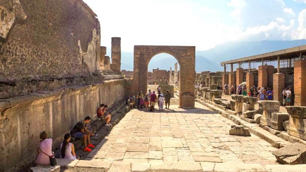 VII.8 Pompeii Forum, August 2021. 
Looking south along west side of Forum towards Arch of Augustus, in north-west corner of Forum. Photo courtesy of Robert Hanson.
