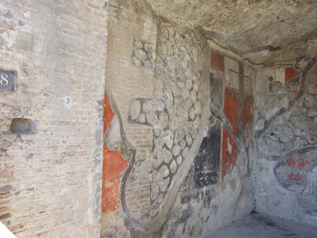 VII.9.68 Pompeii. March 2009. West wall of shop-room.