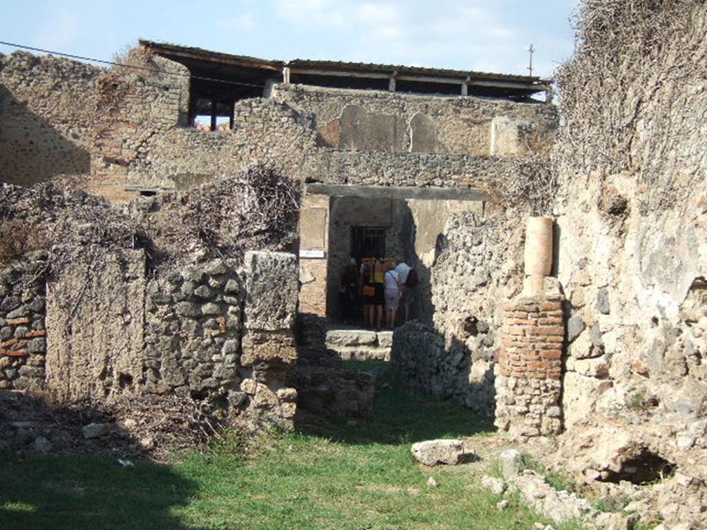 VII.12.13 Pompeii.  September 2005.  Looking north from bakery to front of shop.
