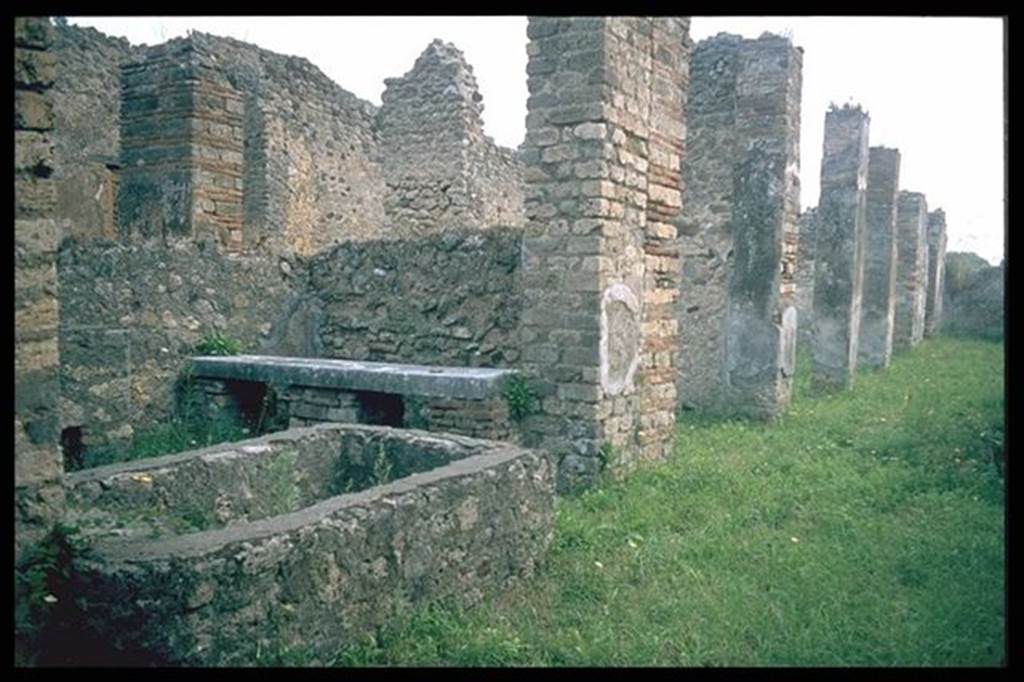 VII.14.18 Pompeii.   Looking east from entrance.  North side, with basin and bench.  Photographed 1970-79 by Gnther Einhorn, picture courtesy of his son Ralf Einhorn.
