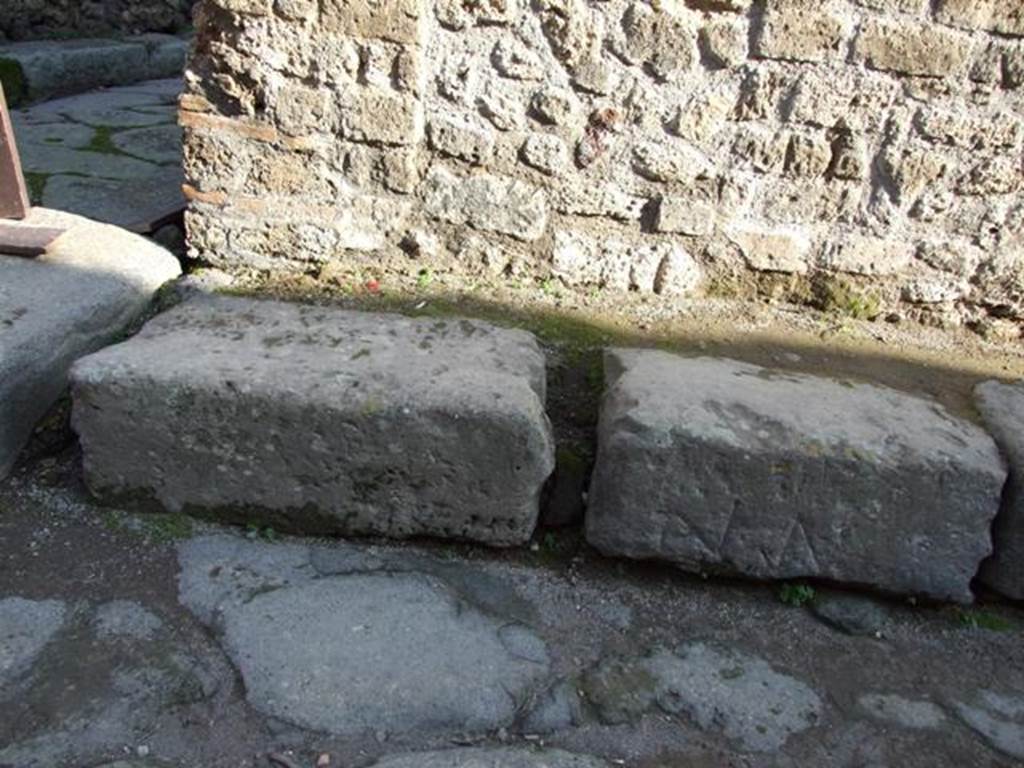 Corner of Vicolo della Maschera and Vicolo degli Scheletri on the east side.  
Kerb with incised marks. December 2007.
