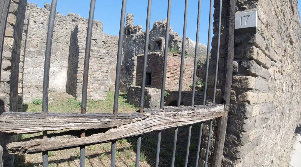 VII.14.19 Pompeii. June 2019. Looking through doorway to kitchen on Vicolo della Maschera.
Note different number now on entrance doorway. Photo courtesy of Christine Thompson.