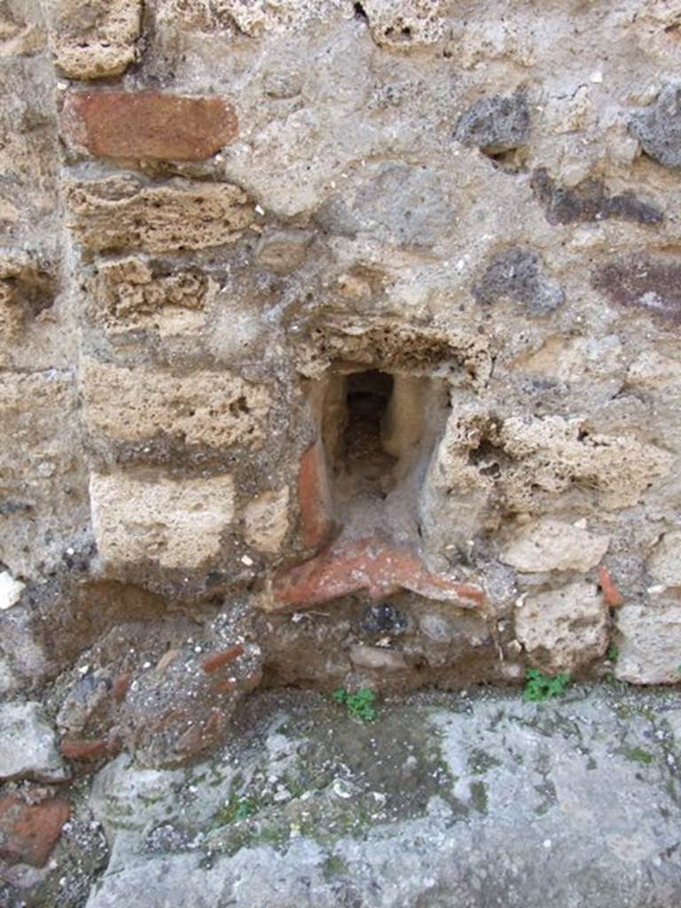 VII.14.19 Pompeii. December 2007. Drainage from house through wall out on to Vico della Maschera.