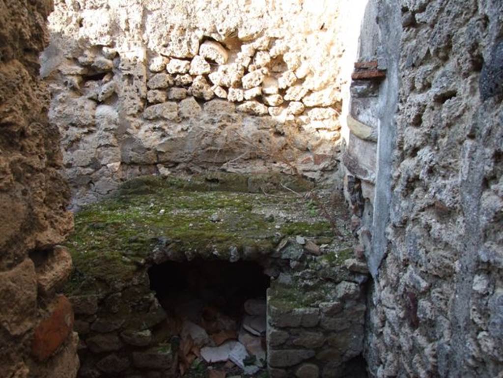 VII.15.13 Pompeii. December 2007. Looking north towards hearth in kitchen area, with lararium on east wall.