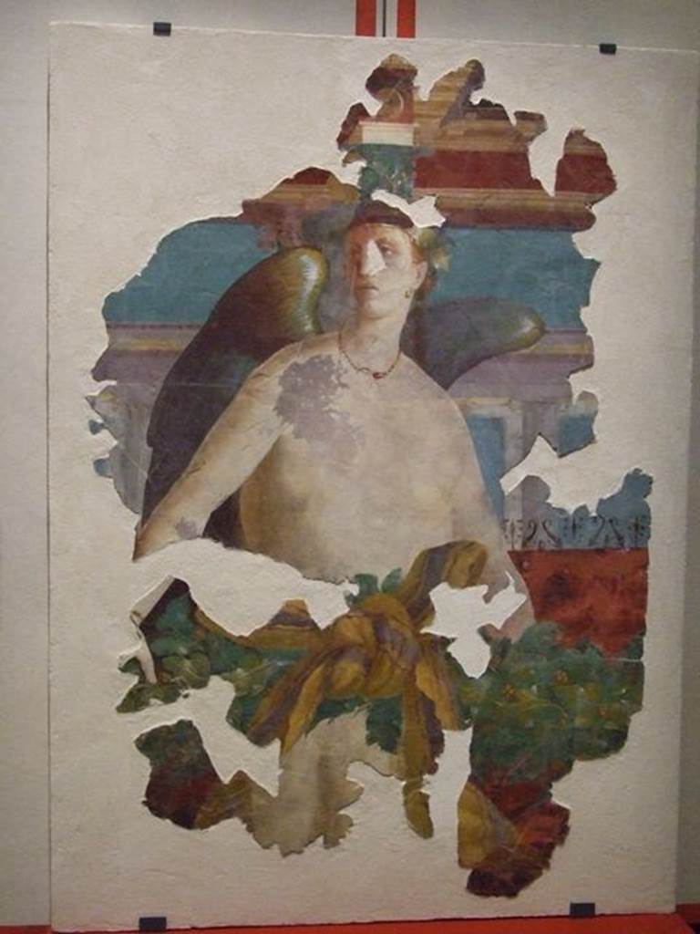 VII.16.17-22 Pompeii. Wall painting of winged female figure, possibly Victoria. PAP 41653. 
Photographed at A Day in Pompeii exhibition at Melbourne Museum. September 2009.
This may have come from the area of oecus 32 and may be the II style winged Nike.
This room has not been photographed.
Or, VI.17.41 Pompeii, according to PPM 
This painting has been wrongly attributed to the tablinum of VI.17.41, the pieces recomposed from numerous fragments and shows a flying female Genius. The characteristics of the figure do not seem to agree with the recognisable remains from the north wall of the tablinum, therefore one must think that the fragments had been found in this area during the excavation in the 1950s and perhaps belong to the decoration of oecus 15 in the south-west of the house at VI.7.41, or of triclinium 20 in the north-west corner of the same house.
See Carratelli, G. P., 1990-2003. Pompei: Pitture e Mosaici. VI. (6). Roma: Istituto della enciclopedia italiana, (p.20, no.22/23.)


