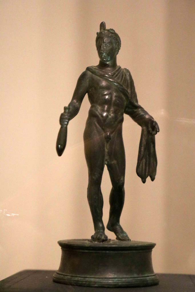 VII.16.17-22, Pompeii. December 2018. Bronze statuette of Mercury holding a sack of coins. 
Parco Archeologico di Pompei, inventory number 13987. Photo courtesy of Aude Durand.

