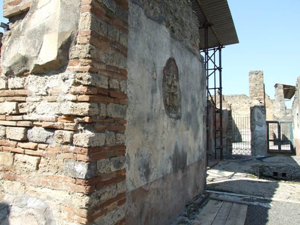 VIII.4.4 Pompeii. March 2009. Room 20, west wall of tablinum. Looking north.
According to Breton, on the west wall facing Leda, the painting was more or less destroyed when excavated.
One could only see a fragment of a sitting person, perhaps Adonis with a dog at his feet.
See Breton, Ernest. 1870. Pompeia, Guide de visite a Pompei, 3rd ed. Paris, Guerin. 
See Helbig, W., 1868. Wandgemlde der vom Vesuv verschtteten Stdte Campaniens. Leipzig: Breitkopf und Hrtel. (961 Endymion?)

According to PPM, at the south end of the west wall in the yellow side panel was another vignette of the Seasons showing Summer (H 984).
Described by Minervini (BAI 1861, p.49) as a naked female figure seen from the rear with cloth draped around her body and legs: in her right hand she held a branch/ear of corn, and a scythe in her left hand.
