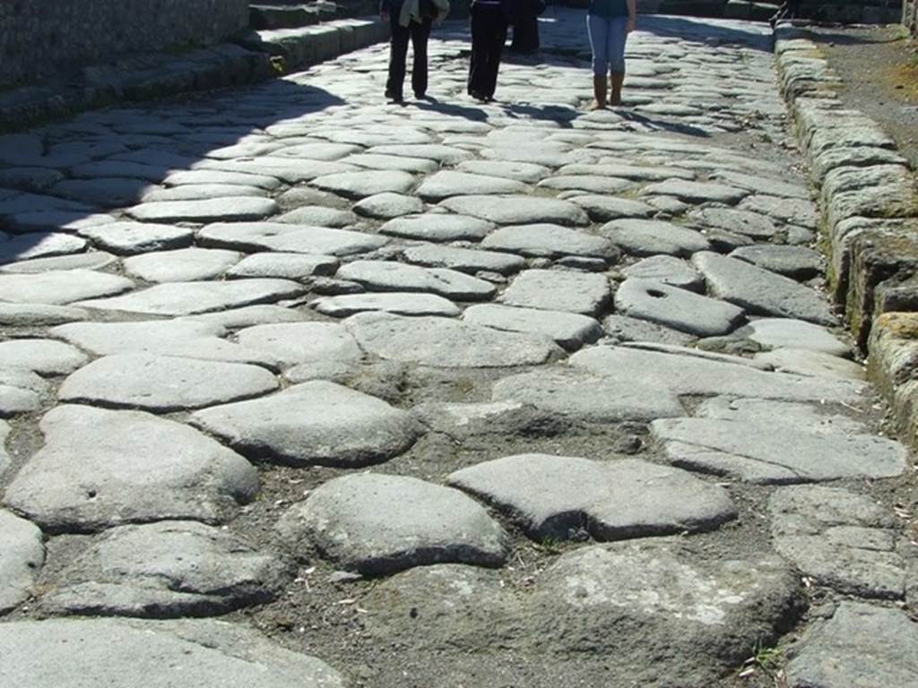 VIII.4.34 Pompeii.  March 2009.  Subsidence in road outside.  Looking west.