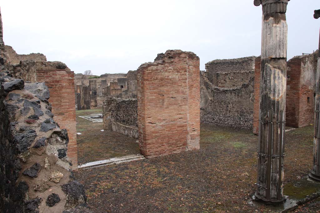 VIII.5.2 Pompeii. October 2020. Looking north from west portico towards doorway to room 6 in north-west corner of portico, on left.  
The doorway to the tablinum is to the right of centre. Photo courtesy of Klaus Heese.
