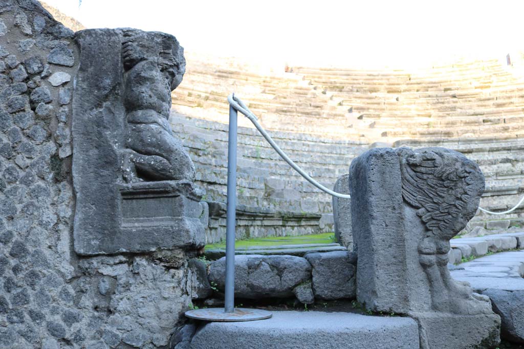 VIII.7.19 Pompeii. December 2018. 
Looking north on west side towards statue of Kneeling Atlas, with a tufa Lion’s foot in front. Photo courtesy of Aude Durand.
