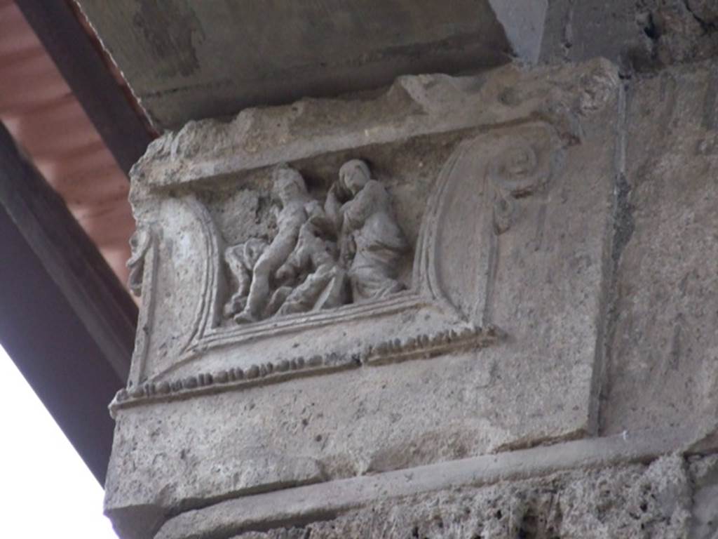 IX.1.20 Pompeii.  December 2007.  Room 2.  Atrium west side. Figured capital from south western corner consisting of a full figure relief of satyrs and bacchantes.
