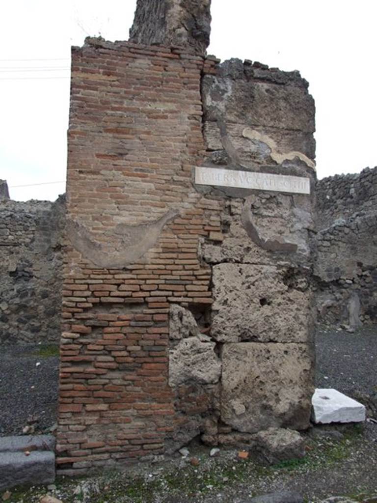 Front wall between IX.3.13 and IX.3.14. December 2007. According to Della Corte, the name of the owner of the caupona was painted in an electoral recommendation to the right of the entrance:
A(ulum)  Vettium  Felicem
aed(ilem)  o(ro)  v(os)  f(aciatis)  Fabius  celer  rog(at)    [CIL IV 3659]
See Della Corte, M., 1965.  Case ed Abitanti di Pompei. Napoli: Fausto Fiorentino. (p.190)

