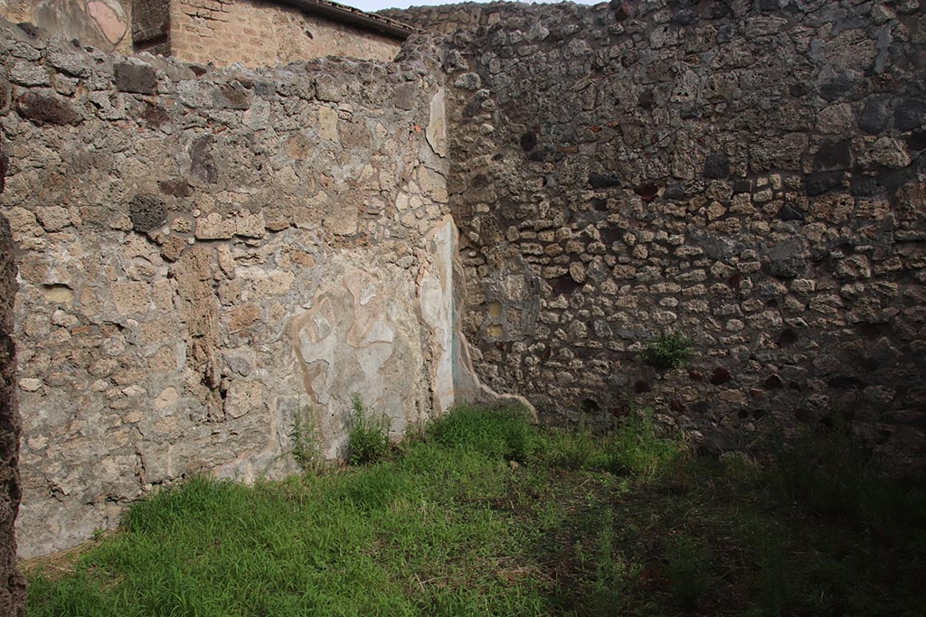 IX.7.19 Pompeii. October 2024. Triclinium g, looking towards north wall, north-east corner and east wall. Photo courtesy of Klaus Heese.