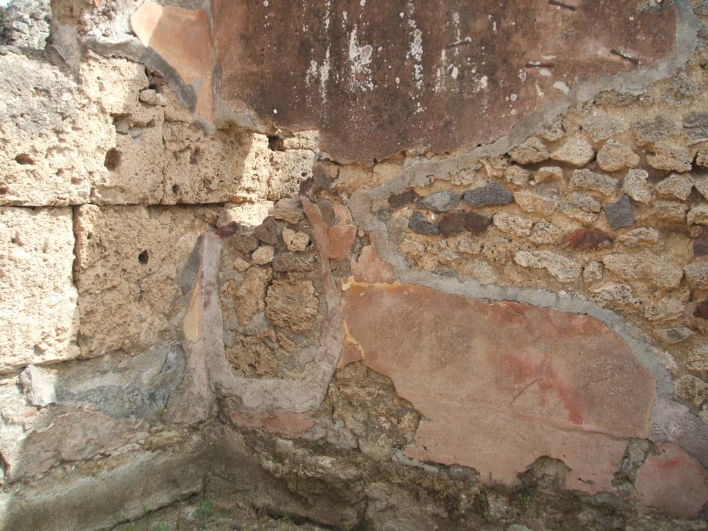 IX.7.22 Pompeii. May 2003.  Remains of painted plaster in the room on east side of caupona. Photo courtesy of Nicolas Monteix.
