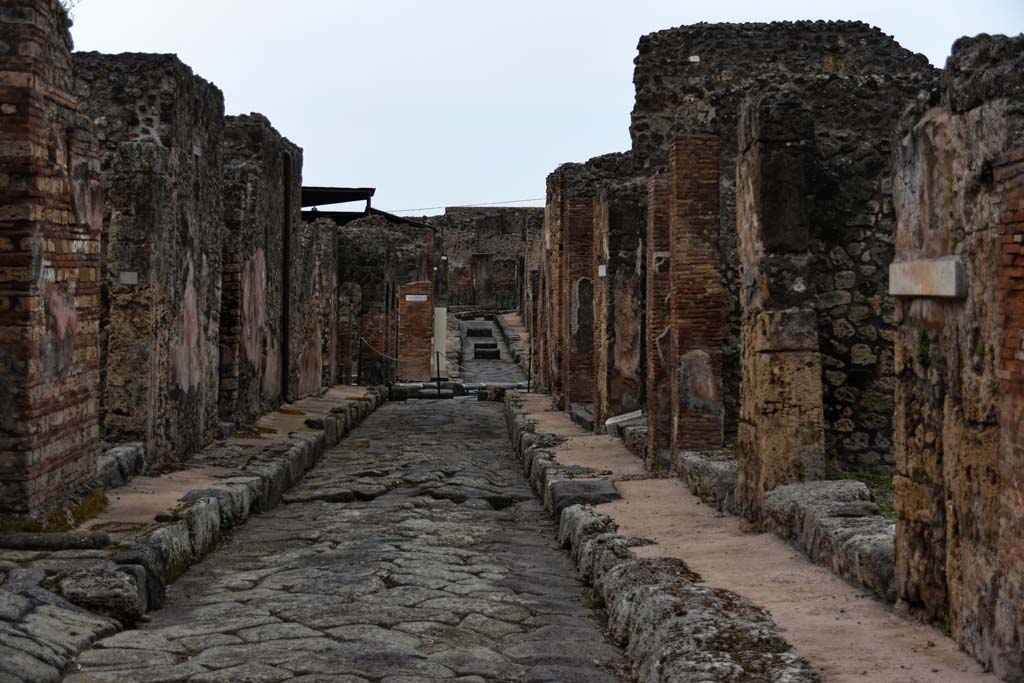 Unnamed vicolo between IX.2 and IX.3. April 2021. 
Looking west from IX.3.17, on right, towards crossroads on Via Stabiana and straight ahead to Via degli Augustali. Photo courtesy of Nicolas Monteix.

