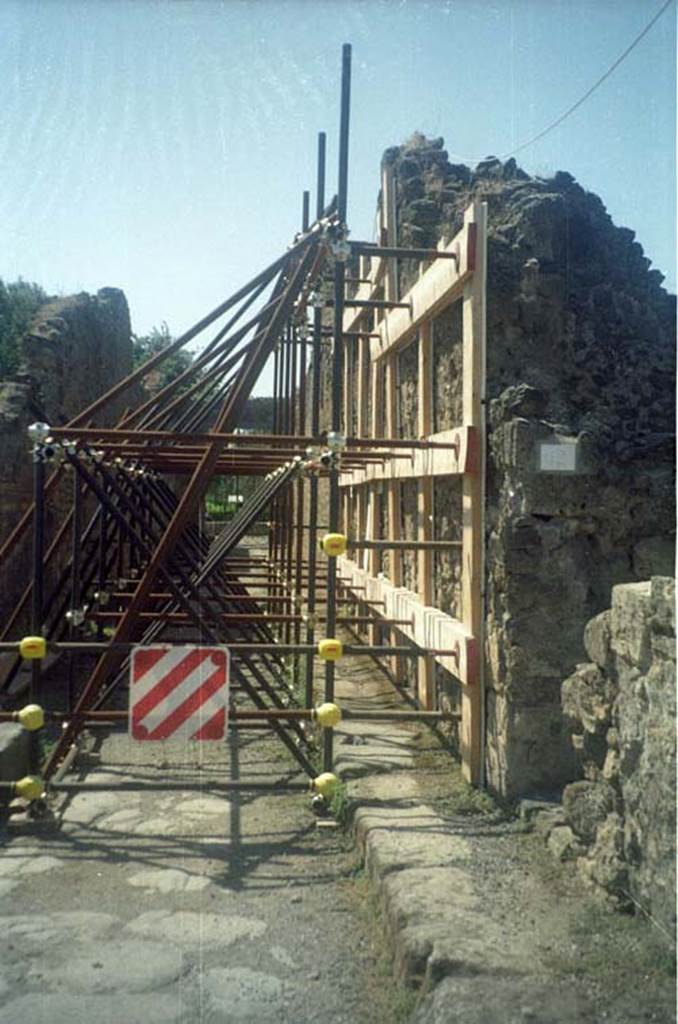 Via dellAbbondanza, south side. July 2011. Junction with unnamed vicolo between both sides of VIII.5. Photo courtesy of Rick Bauer.