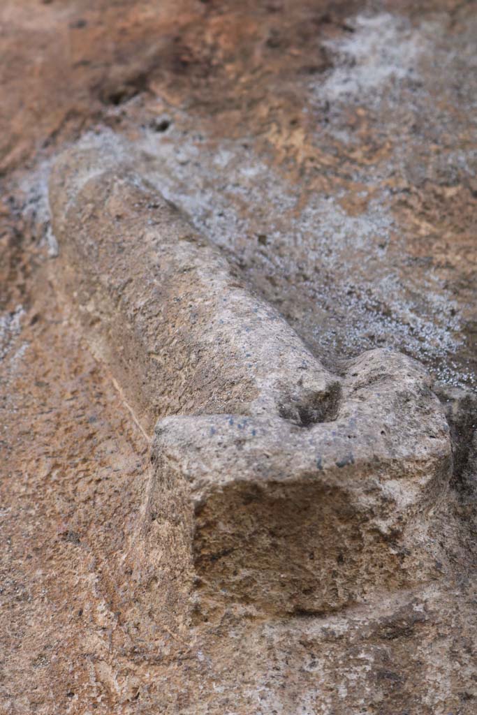 Vicolo della Maschera, west side, at junction with Vicolo degli Scheletri. December 2018. 
Phallus carved in stone block at corner of Vicolo della Maschera and Vicolo degli Scheletri. 
Photo courtesy of Aude Durand.

