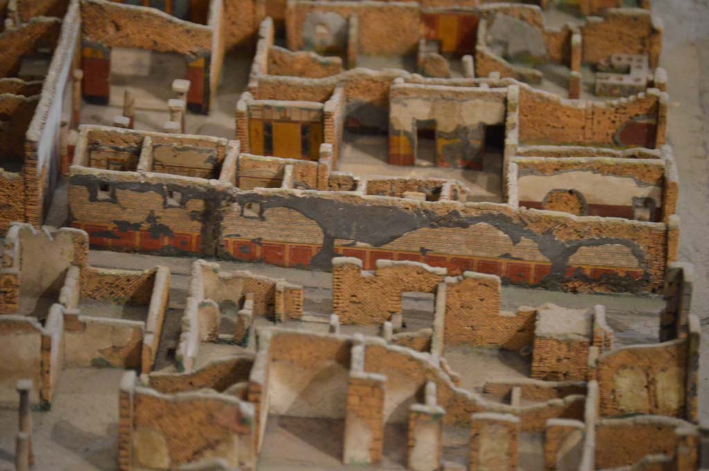 Vicolo della Fullonica, Pompeii. March 2018. Looking east, detail of remaining decoration on lower wall of VI.8.3. 
Foto Taylor Lauritsen, ERC Grant 681269 DÉCOR.

