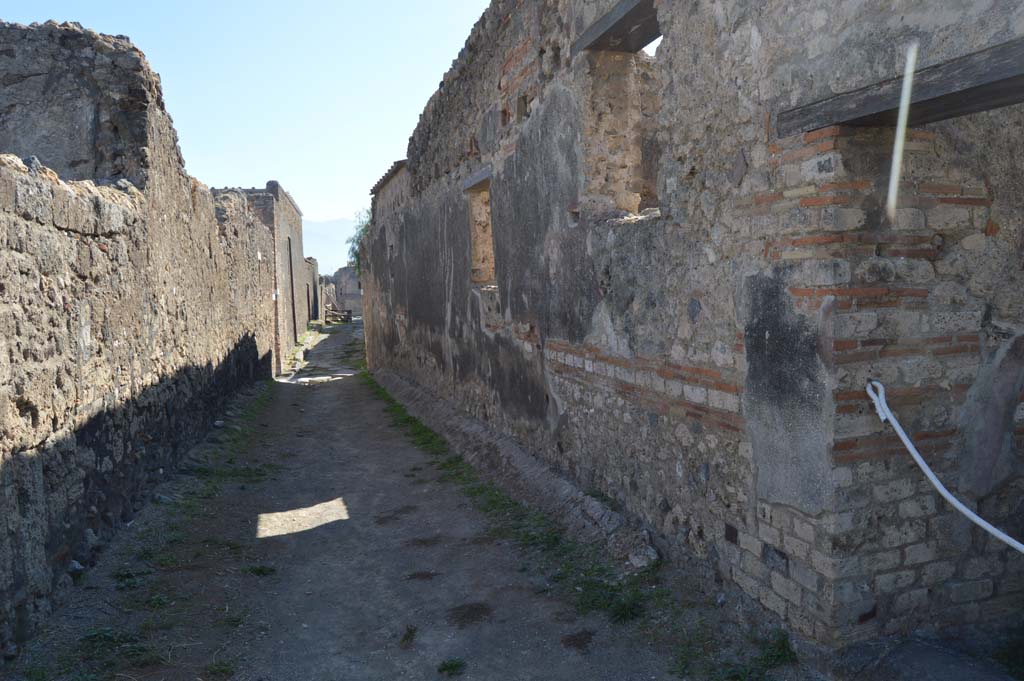 Vicolo della Fullonica, May 2011. Looking south along west side from outside doorway of VI.5.19. 