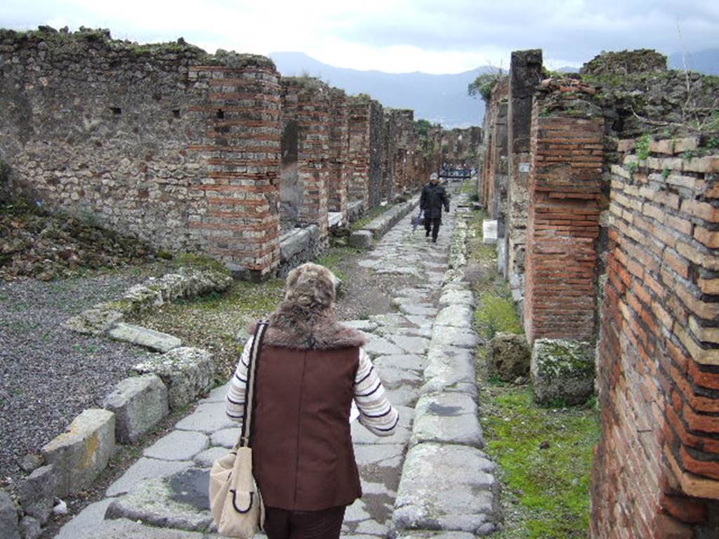 Vicolo di Eumachia, Pompeii, described as Rue? Venus. 
From an Album by M. Amodio, c.1880, entitled “Pompei, destroyed on 23 November 79, discovered in 1748”.
Looking south from junction with Vicolo del Balcone Pensile, (centre left and right). Photo courtesy of Rick Bauer.

