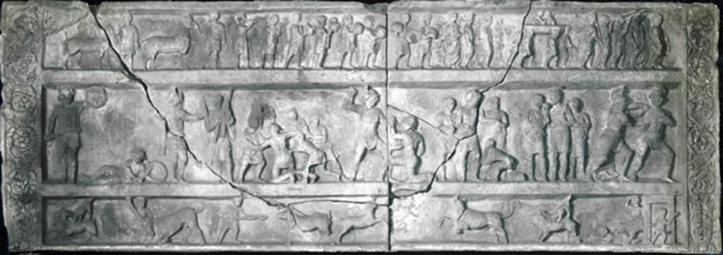 SG6 Pompeii. Gladiatorial relief with hunting scenes from a tomb at Porta Stabia. 
Now in Naples archaeological Museum. Inventory number 6704.
According to Emmerson, this relief measures more than 4 metres long and 1.5 metres high.
See Emmerson A., 2010. Reconstructing the Funerary Landscape at Pompeii's Porta Stabia: Rivista di Studi Pompeiani 21, pp. 78, fig. 1.
According to Osanna, the relief is in fact compatible with the monument, as its length is about 4 metres long and it was found out of place, precisely in the area of Porta Stabia.