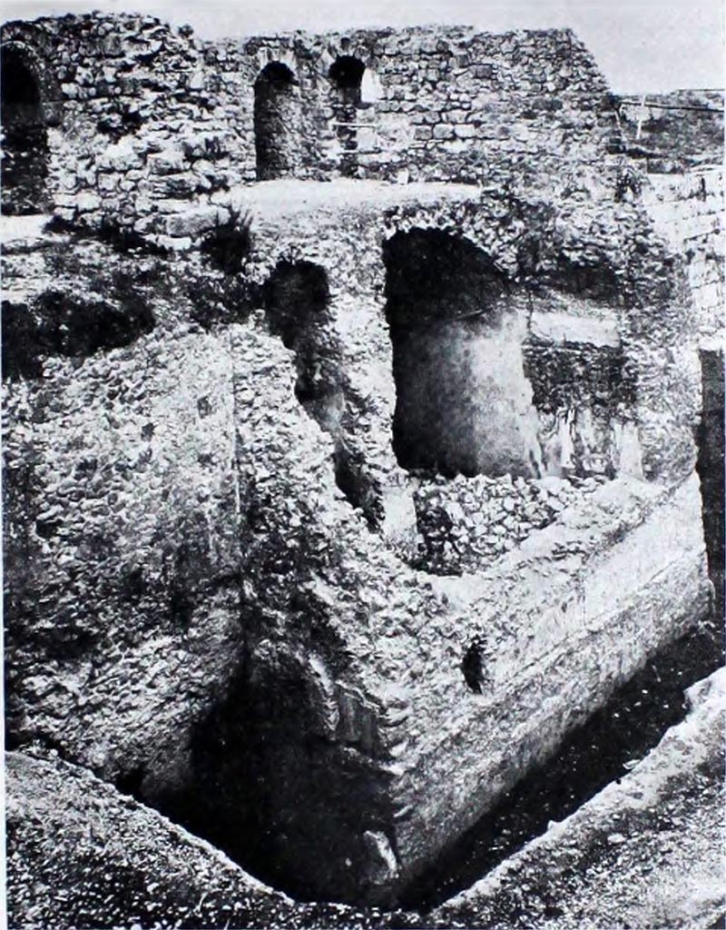 Tower XI, Pompeii or Tower XII? Pre 1944. Looking south-west towards north side of Tower.
This is shown in NdS (as below) as being from Tower XI and is very similar to Tower XII in its current state of preservation.
According to NdS –
Un restauro parziale, suggerito dall’opportunità di giovarsi di una delle torri per avere una veduta panoramica delle rovine, venne precedentemente eseguito della Torre XI, più comunemente nota con il nome di Torre della Via di Mercurio: il restauro si limitò al secondo ripiano della torre. La fotografia a fig. 13 mostra quale fosse lo stato di conservazione delle strutture esterne ed interne prima della ripresa della cortina murarie e delle volte.
(A partial restoration, suggested by the opportunity to take advantage of one of the towers to give a panoramic view of the ruins, was previously carried out on Tower XI, more commonly known as the Tower of the Via di Mercurio: the restoration was limited to the second level of the tower. The photograph in fig. 13 shows the state of conservation of the external and internal structures before the restoration of the curtain wall and the vaults.)
See Notizie degli Scavi di Antichità, 1944-45, (fig. 13, p. 293)

