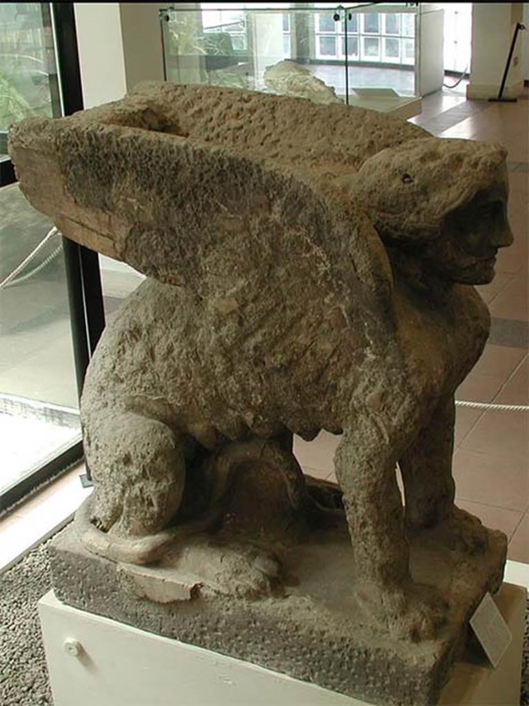 Boscoreale now Pompeii, Villa rustica nel Fondo di Antonio Prisco.
Statue of a seated sphinx with feline body, female head and large wings.
The statue was found out of its original funerary context so we cannot be certain that it was attributable to this tomb “D”. 
Now in Boscoreale Antiquarium. SAP inventory number 25896.

