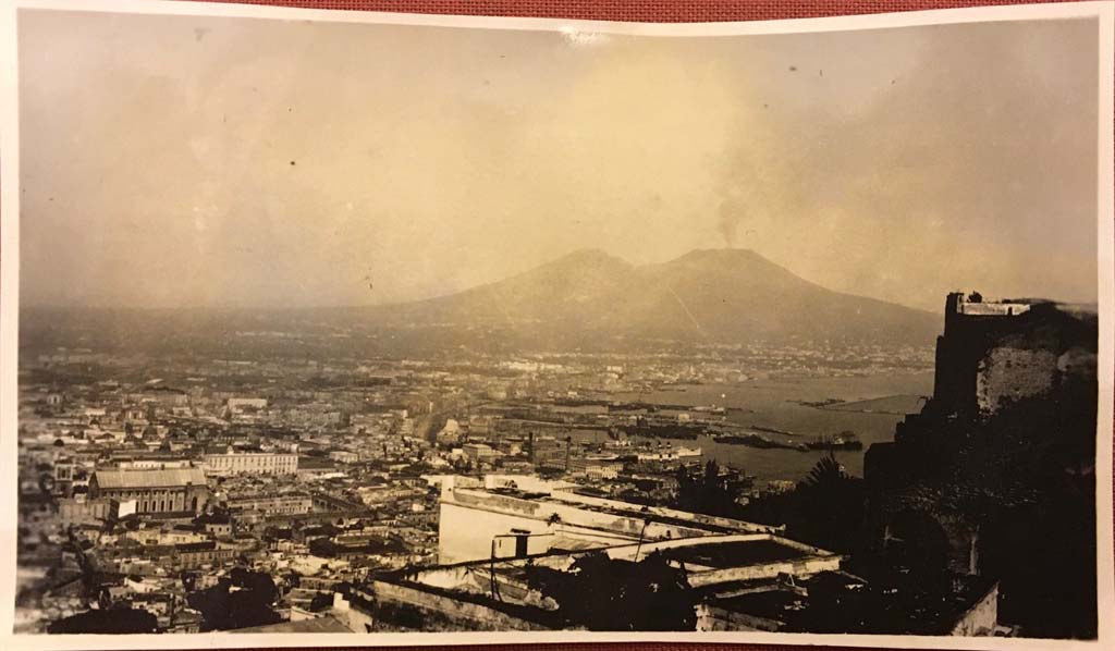 Vesuvius, 1860-1890. View of Naples from the Vomero district, with Vesuvius in the distance.
Photo title at bottom is “No. 1165. Napoli. Panorama dal Vomero Sommer – Napoli”. 
Museum für Kunst und Gewerbe Hamburg, inventory number P1981.370 (Public Domain).
See https://sammlungonline.mkg-hamburg.de/de/object/No.-1165.-Napoli.-Panorama-dal-Vomero/P1981.370/mkg-e00135889
